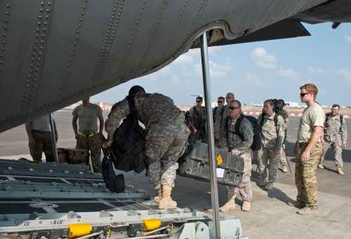 US Army soldiers from 1st Battalion, 63d Armor Regiment, the core element of the East Africa Response Force, load gear onto a C-130 Hercules during a response force training exercise on November 8th, 2013 at Camp Lemonnier, Djibouti.
