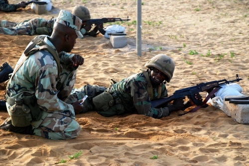 A Liberian rifle range line coach instructs a soldier from the Armed Forces of Liberia in order for him to complete his annual rifle qualifications on the range at at Edward Beyan Kesselly Barracks in the country's capital Monrovia, 1 April 2011.