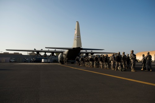 Soldiers from the East Africa Response Force load on a C-130H from the 52nd Expeditionary Airlift Squadron at Camp Lemonnier, Djibouti en route to Juba, South Sudan in December 2013.