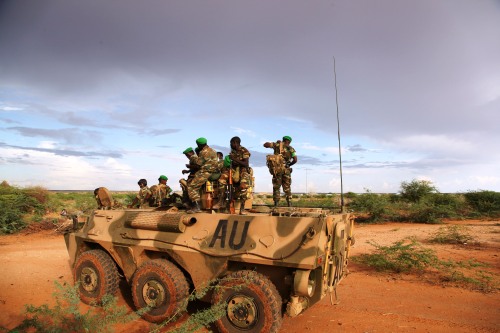 AMISOM troops stand on top of a WZ551 armored personnel carrier on the outskirts of Burubow in the Gedo region of Somalia in March, shortly after it was liberated from Al Shabaab control.